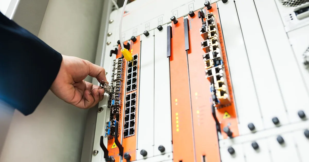 An engineer adjusting network infrastructure
